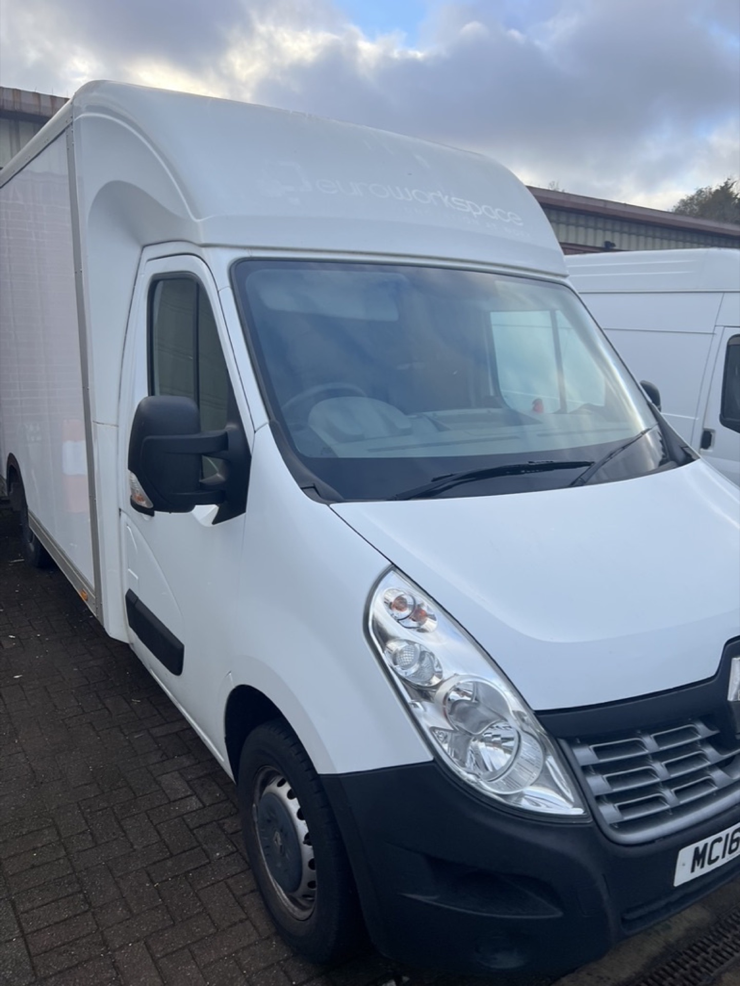 White Renault Master low-loader van with the previous owner's signwriting still on the luton