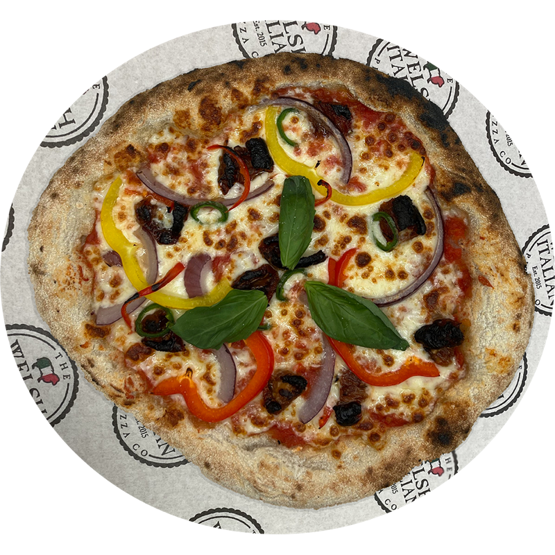 A hot summer pizza with red onion, sun-dried tomatoes and chillies