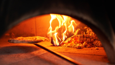 Are You Tired of Soggy Pizza? Discover the Secret to Our Perfectly Crispy Pizzas: Wood-Fired Ovens!
