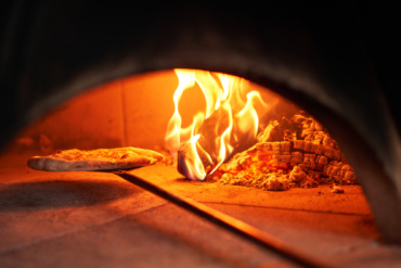 Are You Tired of Soggy Pizza? Discover the Secret to Our Perfectly Crispy Pizzas: Wood-Fired Ovens!