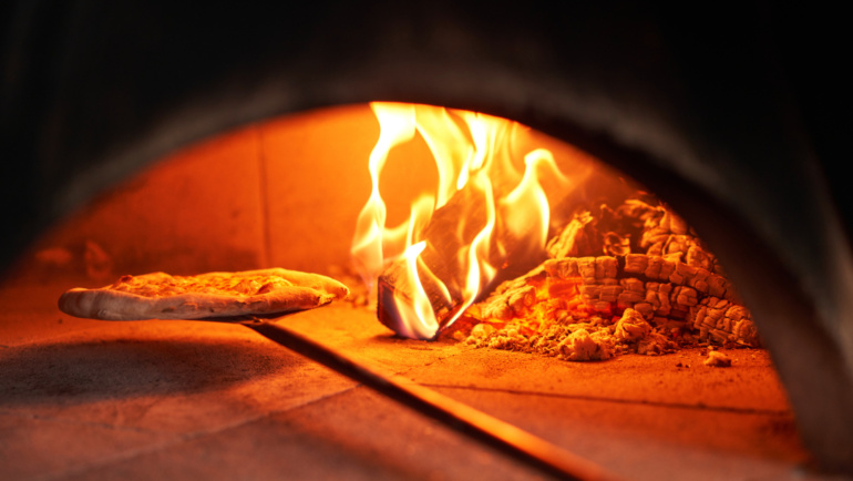 Are You Tired of Soggy Pizza? Discover the Secret to Our Perfectly Crispy Pizzas: Wood-Fired Ovens!